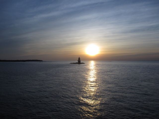 Lighthouse at sunset from the ferry going to Connecticut