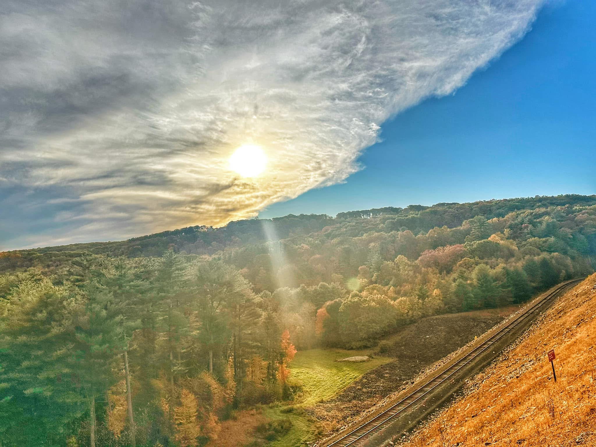 Fall view with the sun shining done at thomaston dam