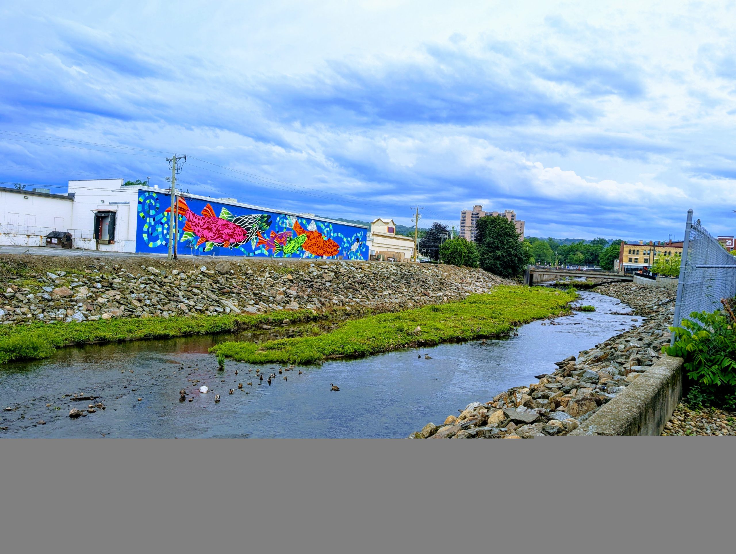 In town view of the Naugatuck River and one of the many murals in Torrington.